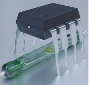 8 Pin dual-in-line integrated circuit in a black plastic package above a reed switch