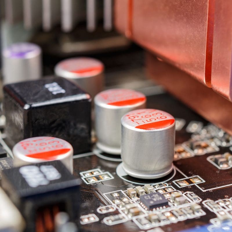 Electrolytic capacitors installed on the motherboard closeup