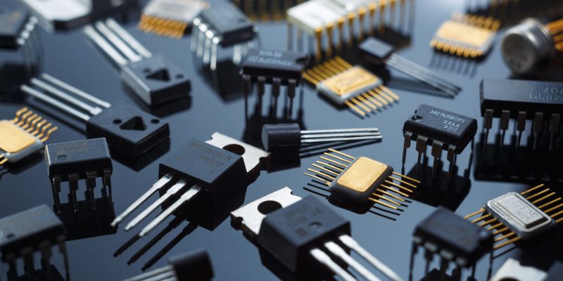 Electronic components close-up. Golden electronic microcircuits.