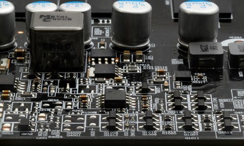Macro close-up image of circuitry (graphics card capactors, resi